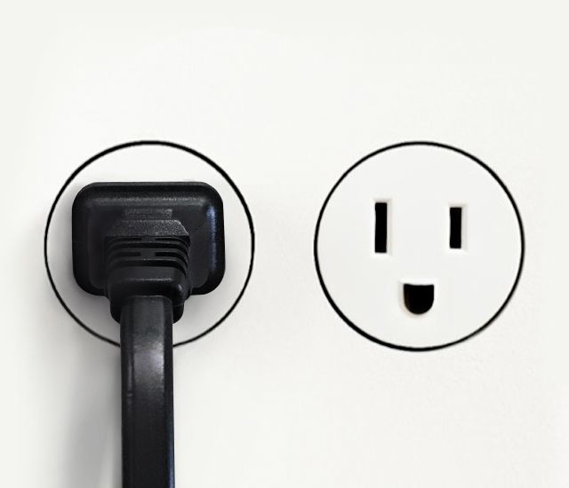 DC Energy black plug in an outlet