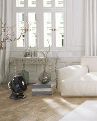 Black 660AE on a wood floor in a living room with lots of cream and beige colors.
