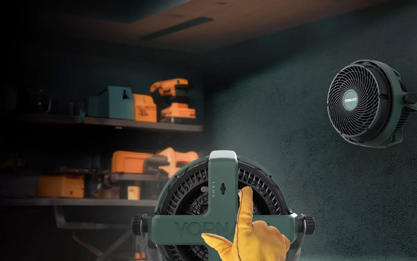 EXO61 HD Hang or Stand An image showing two EXO61 HD fans in a garage. One fan is hanging on the wall. The other fan is centered in the image with a yellow glove adjusting the angle settings.