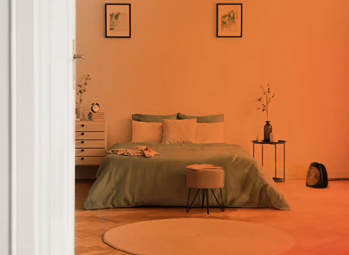 Whole Room Heat Circulation Bedroom through an open door with an orange gradient to show whole Room heat circulation