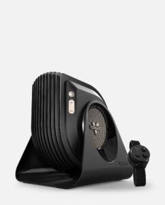 Vornado FLY MAX Hero with vertical grille and side buttons along with magnetic remote and strap