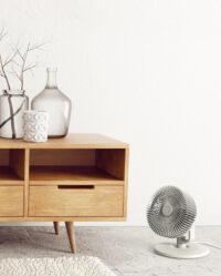 Vornado REFRESH 8 on the floor of a living room pushing air to the other side of the room
