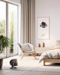 Vornado STRATA 8T on the floor of a bedroom pointing its airflow at the bed in the middle of the room