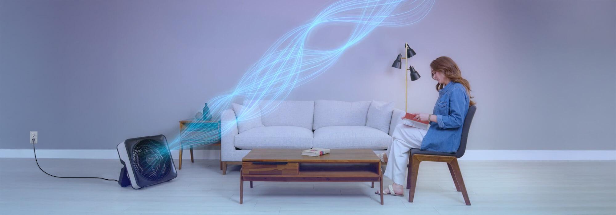 Woman sitting while Model 80X is blowing out cool air