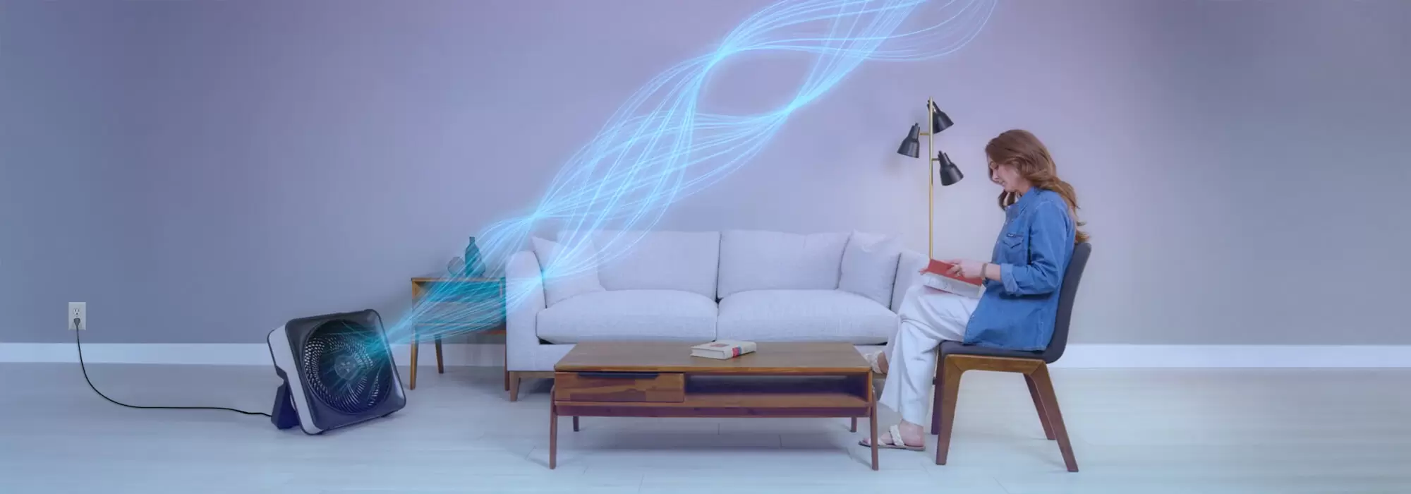 Woman sitting while Model 80X is blowing out cool air