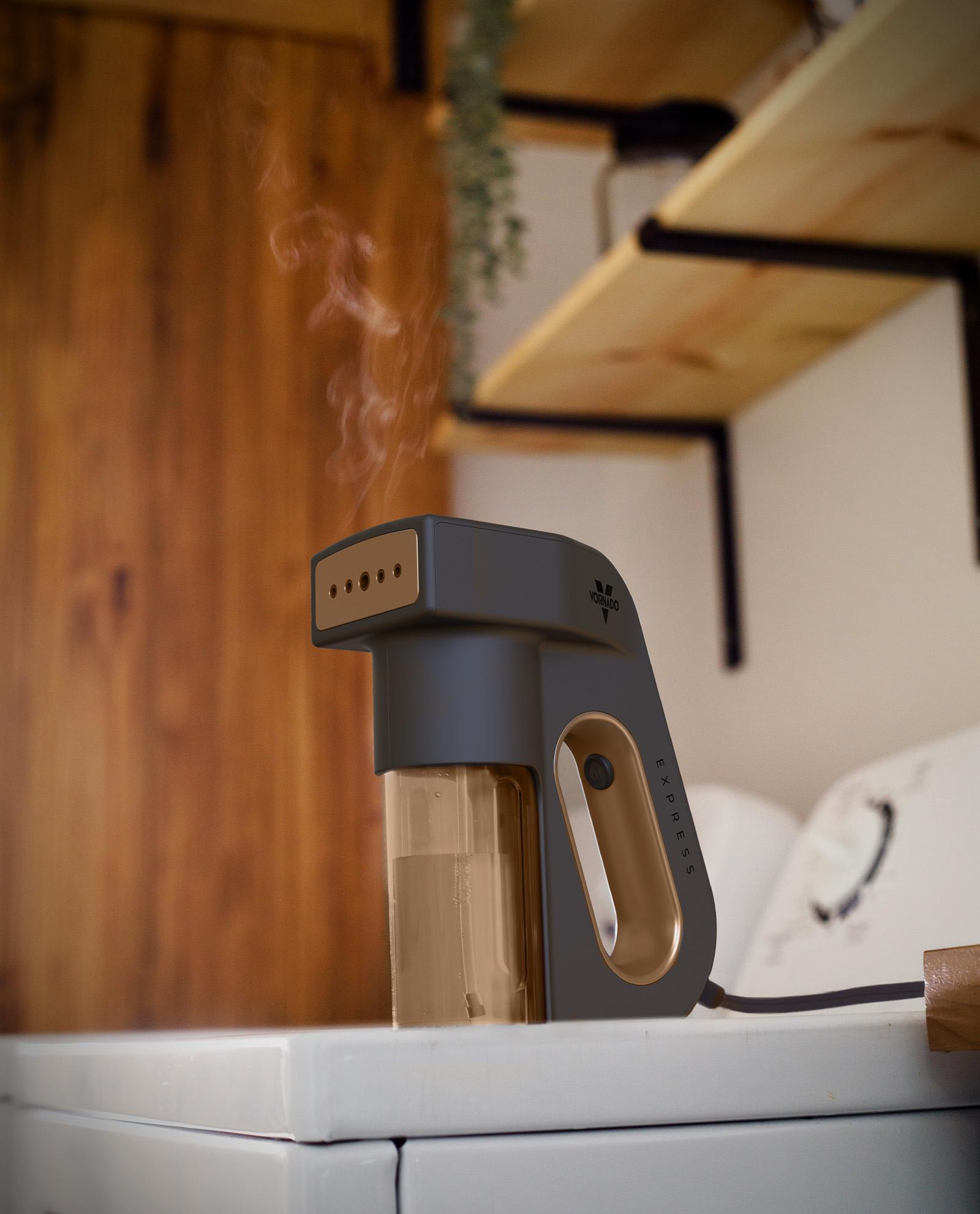 Vornado Express handheld garment steamer on top of a dryer.