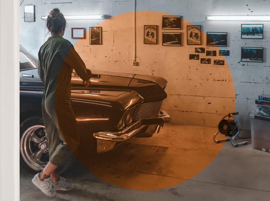 A woman working on a car in her garage with velocity hd+ on the floor. Velocity HD+'s Spot Heat shown with an orange transparent circle.