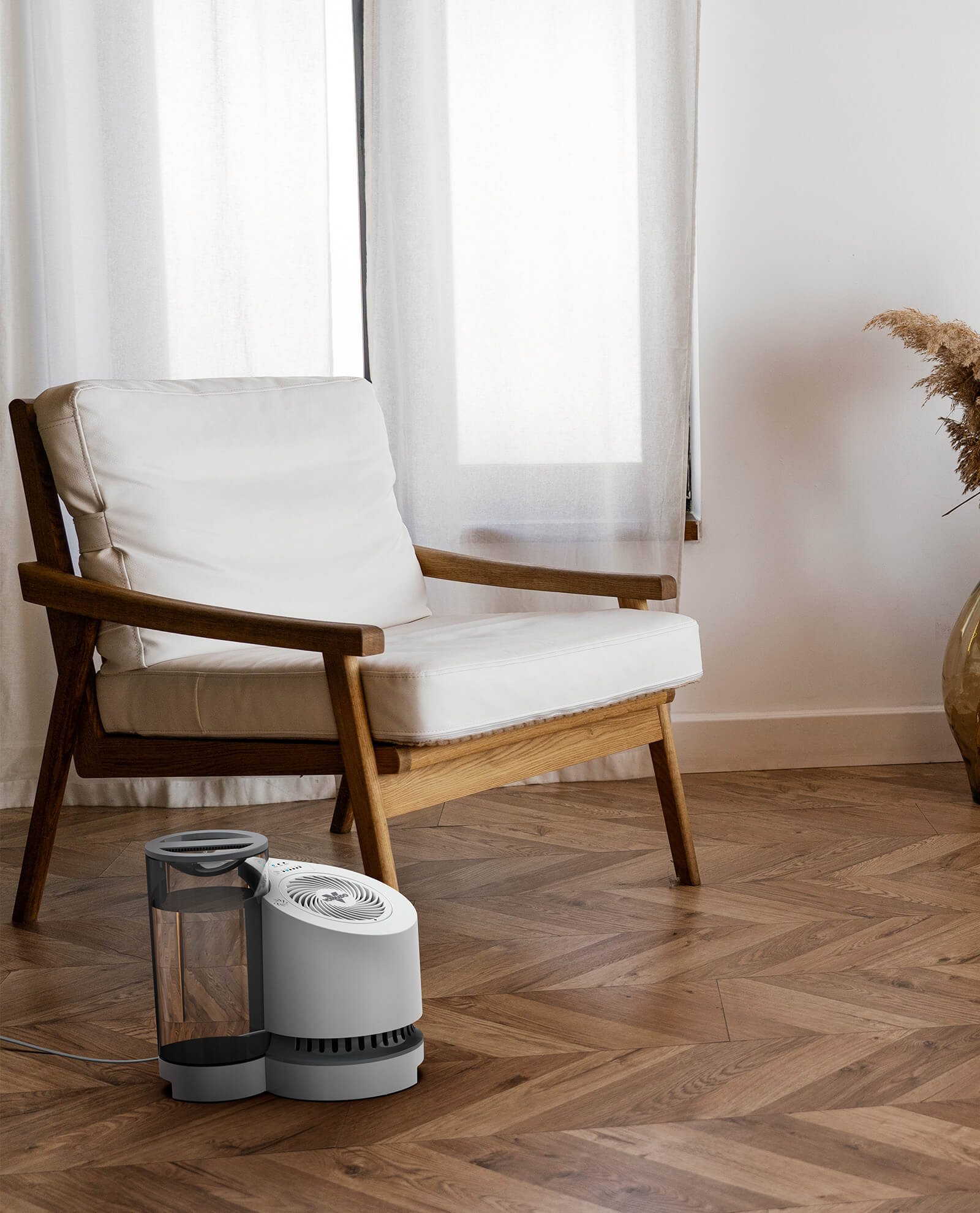 lifestyle of a ev100 evaporative humidifier in a living room near a chair