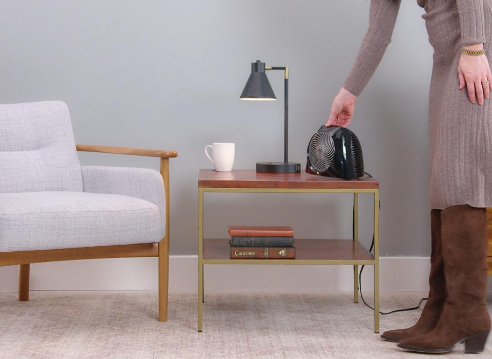 woman picking up VH204 with its Integrated Handle